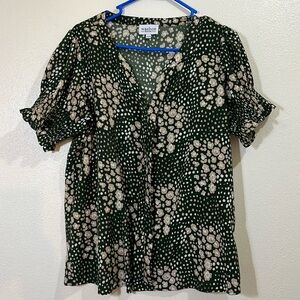 Washco short sleeved forest green blouse with floral pattern. Size Medium.